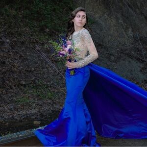 This is a RACHEL ALLAN dress, it’s beautiful. Only wore once, for prom.